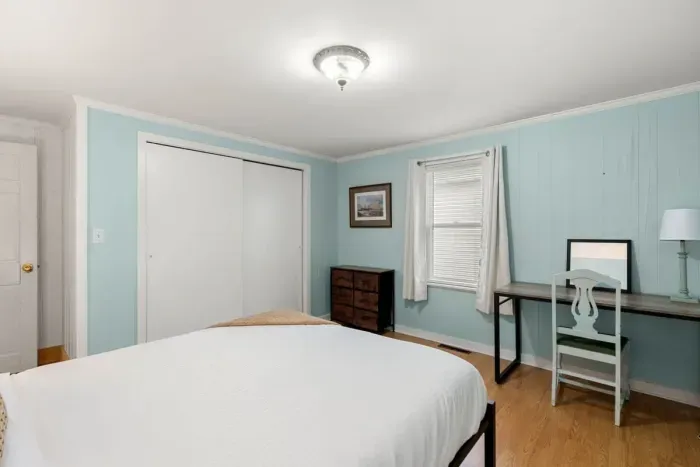 Bedroom #1, located on the first floor with a queen bed.