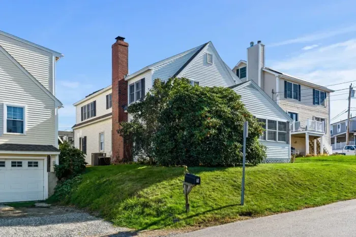 Street View. Off-street parking for 3 cars tandem. NO PARKING ALLOWED ON GRASS OR STREET