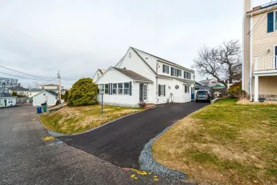 Street view of the home with the new driveway and hardscaping!