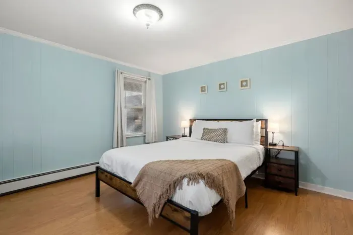 Bedroom #1, located on the first floor with a queen bed.