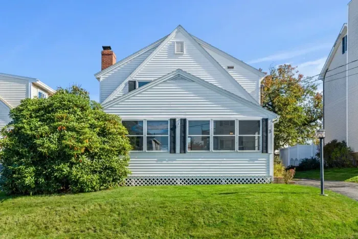 Street View. Off-street parking for 3 cars tandem. NO PARKING ALLOWED ON GRASS OR STREET