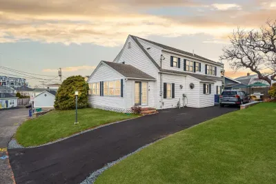 Street view of the home with the new driveway and hardscaping!