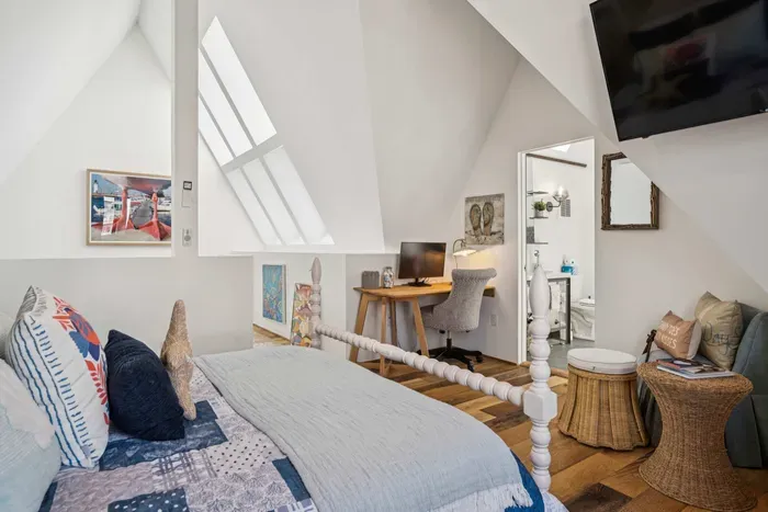 Master suite with queen-size bed and an area where you can work