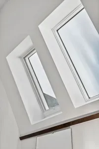 Roof window with natural light beaming through the house