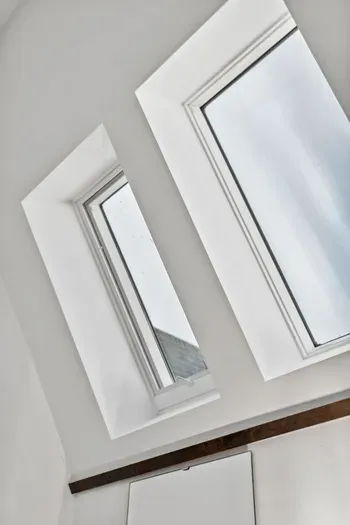 Roof window with natural light beaming through the house