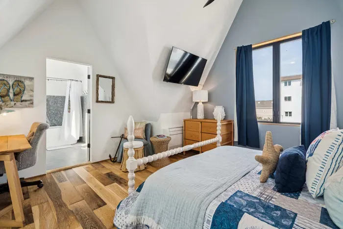 Master suite with queen-size bed and an area where you can work