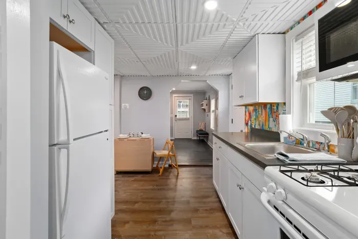 Full stocked kitchen, gas stove, and foldable dining table for 6 people.