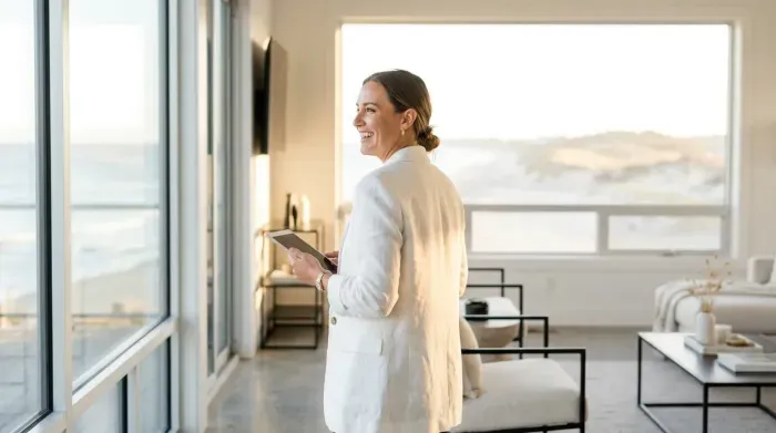Homeowner reviews the Seacoast 2 Summit experience on a tablet