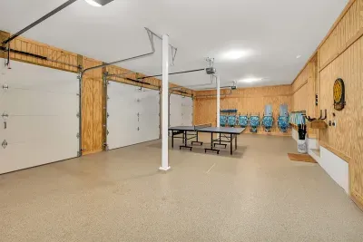 3 car garages with high speed charger for e-vehicles and table tennis and beach chairs and umbrellas