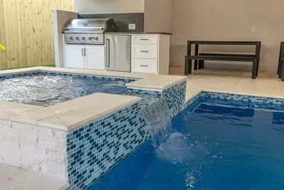 heatable salt water pool with hot tub, natural gas barbecue grill, dining area, 75' TV, Sonos Sound System