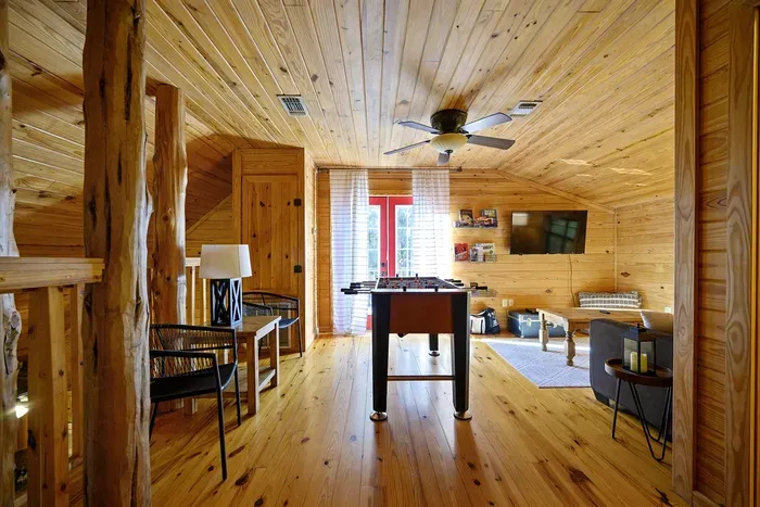 2 seating Areas with a foosball table