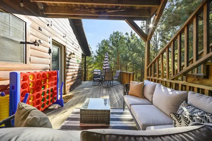 Large patio right off the kitchen with seating and GIANT connect 4