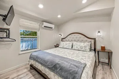 Master bedroom with a king bed