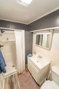 The cozy bathroom gets you clean after a fun day at and on the lake.