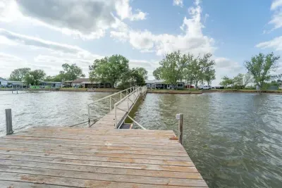 Enjoy fishing and playing from the front porch or from the dock.