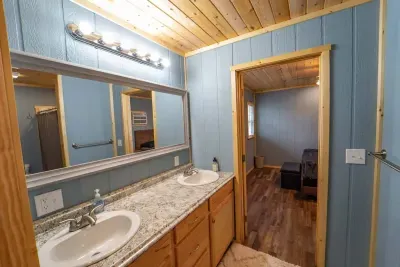 This bathroom is in the detached living quarters.  It ideal for privacy.  The detached living quarters includes two bedrooms and a bathroom.  The bathroom has double sinks and a roomy shower.
