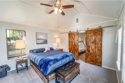 Roomy main bedroom offers direct lake access.  Enjoy getting up in the morning and feeling the lake breeze from the bedroom entry way.  The main bedroom has an adjacent bedroom ideal for children or other guests.