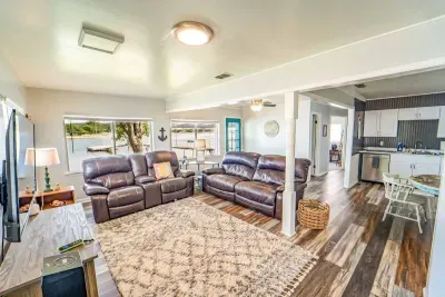 The living room offers an abundance of windows.  You can keep an eye on the lake while watching TV and drinking coffee.