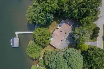 Aerial view of the property and Lake Norman showcasing all the trees that provide shade on hot days