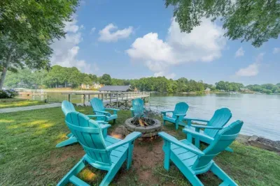 Outdoor Oasis: Gather around the fire pit with stunning lake views and Adirondack seating