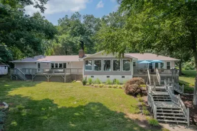 Backyard: View of the home from Lake Norman, with multiple decks and plenty of seating