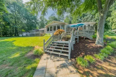 Backyard: View of the home from the dock, with multiple decks and plenty of seating
