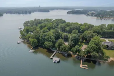 Aerial view of the property and Lake Norman showcasing all the trees that provide shade on hot days