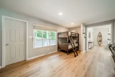 Common area with huge LCD TV and 4 twin-sized bunk beds