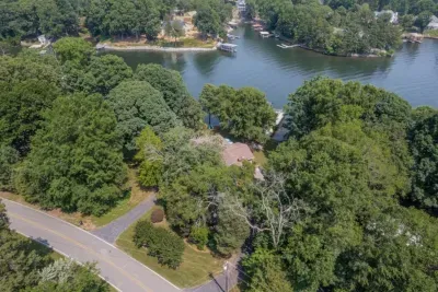 Aerial view of the property and Lake Norman showcasing all the trees that provide shade on hot days