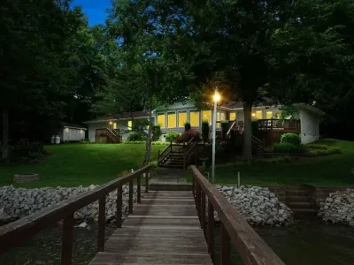 Backyard: Evening view of the home from Lake Norman, with multiple decks and plenty of seating