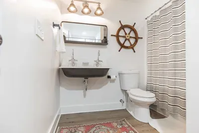Fun bathroom connected to the downstairs king bedroom and accessible from the downstairs living area.