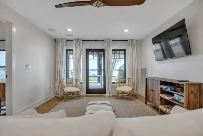 Downstairs living area with a pullout sofa, Sony HDTV, and several games for family game night.