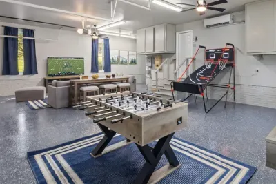 Enjoy our NEW game room featuring foosball, shuffle board, pop-a-shot, and a large seating area to watch TV