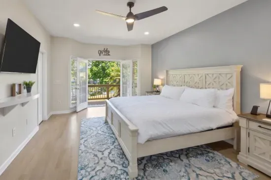 Wake up refreshed in the primary bedroom to serene views of the backyard and the lake… nature's perfect start to your day!
