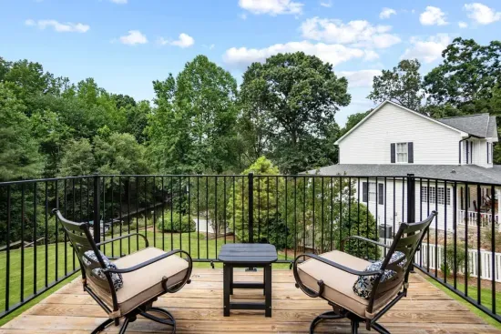 The king bedroom in the apartment space features its own private deck, offering a peaceful retreat and the perfect spot to relax outdoors.