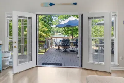 The living room opens up to the expansive deck with lake view.  A prefect spot for enjoying the outdoors.