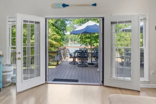 The living room opens up to the expansive deck with lake view.  A prefect spot for enjoying the outdoors.