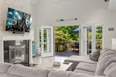 Gather in the living room to watch movie or step out to the huge deck to enjoy the outdoors