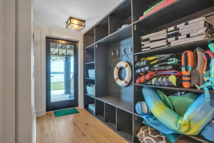 Mudroom with lake equipment and washer and dryer. Perfect spot for coming in off the lake.