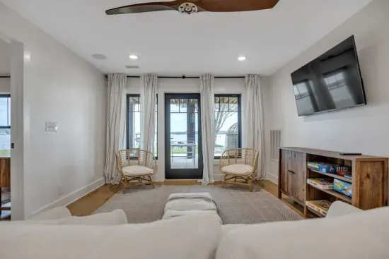 Downstairs living area with a pullout sofa, Sony HDTV, and several games for family game night.