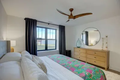 Downstairs king bedroom with lake views and ensuite bathroom.