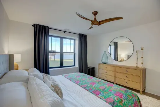 Downstairs king bedroom with lake views and ensuite bathroom.