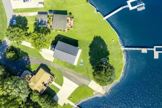 Overhead view of the home, property and dock.