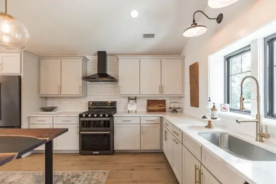 Brand new KitchenAid appliances, quartz countertops, and a custom built island.