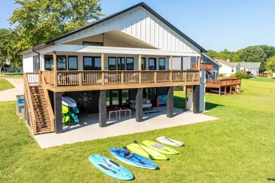 Adult & child kayaks and stand-up paddle boards ready for your lake adventure!