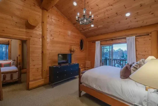 Unwind in this spacious guest room with a king bed, soft lighting, and private outdoor access—perfect for quiet mornings and restful nights.