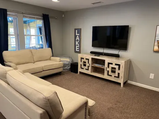 The downstairs living room has plenty of seating to watch your favorite movie or show in a separate area from the main floor.