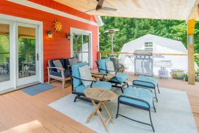 The deck is expansive, with BBQ Grill and covered seating area to sit back and relax watching the lake!