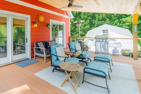 The deck is expansive, with BBQ Grill and covered seating area to sit back and relax watching the lake!
