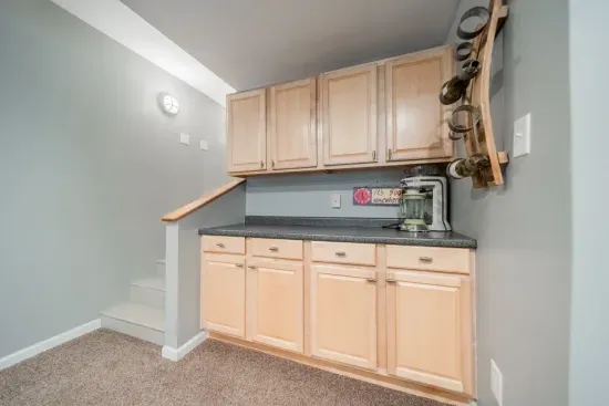 The downstairs living area also has a counter for making drinks and storage as needed.
